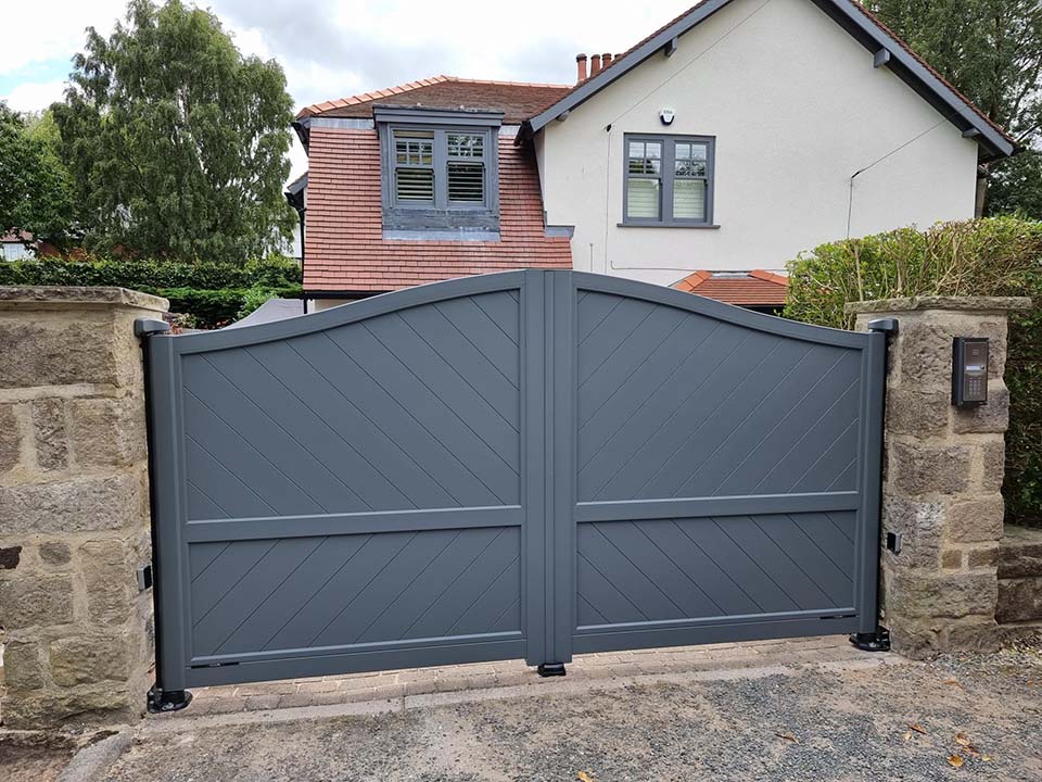Curved top swing gates with herringone infill in RAL 7016